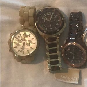 Three Michael Kors watches